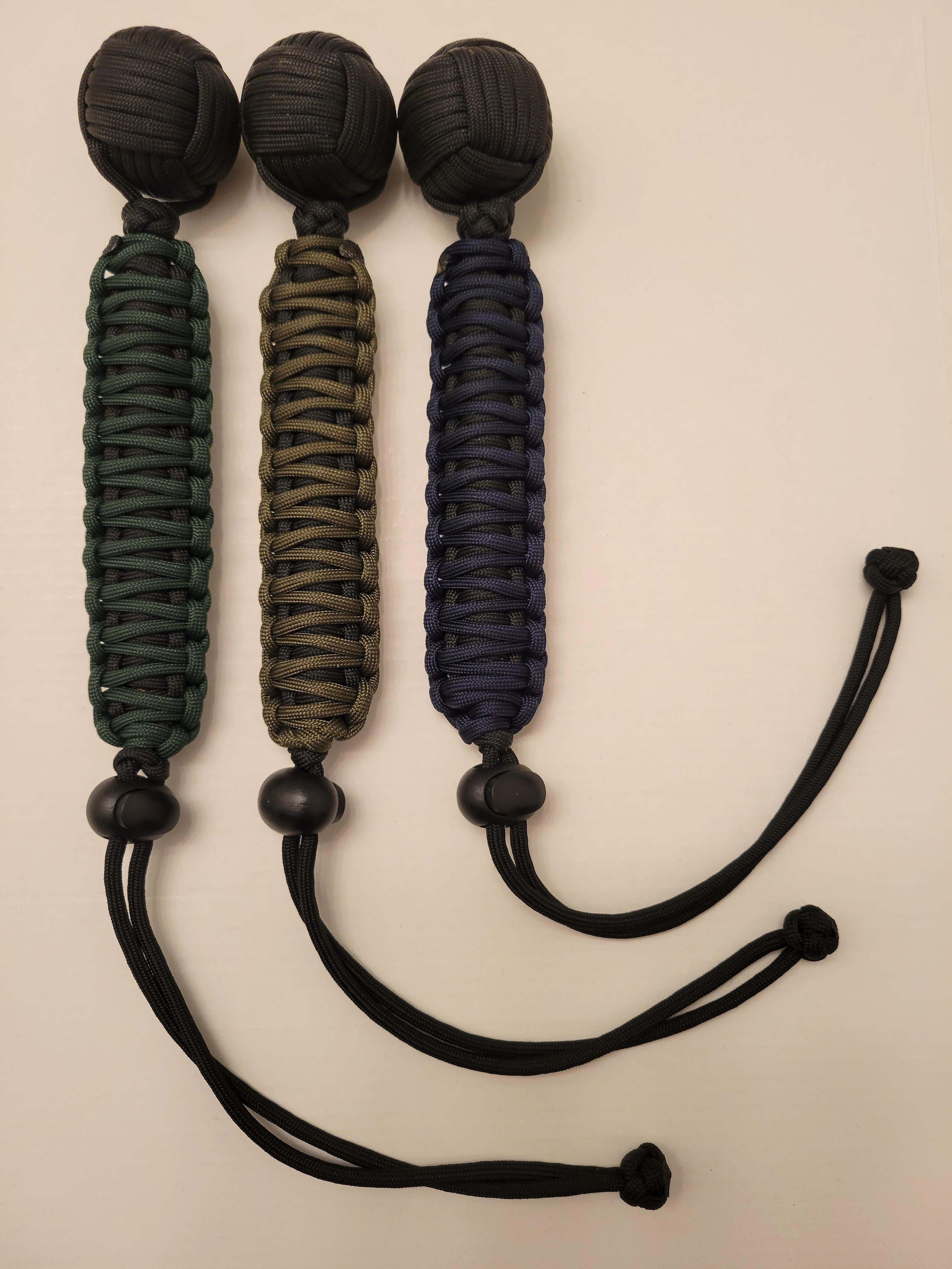 Monkey fist tools with adjustable straps in a variety of colors